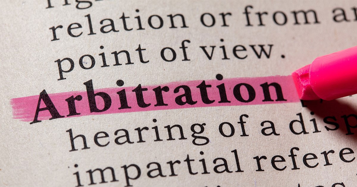 The word "Arbitration" highlighted in pink on a page with other text.