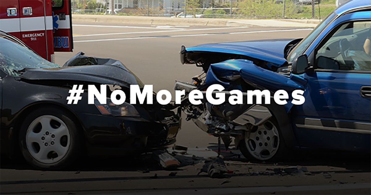 Two cars in a head-on collision with bold text '#NoMoreGames.'