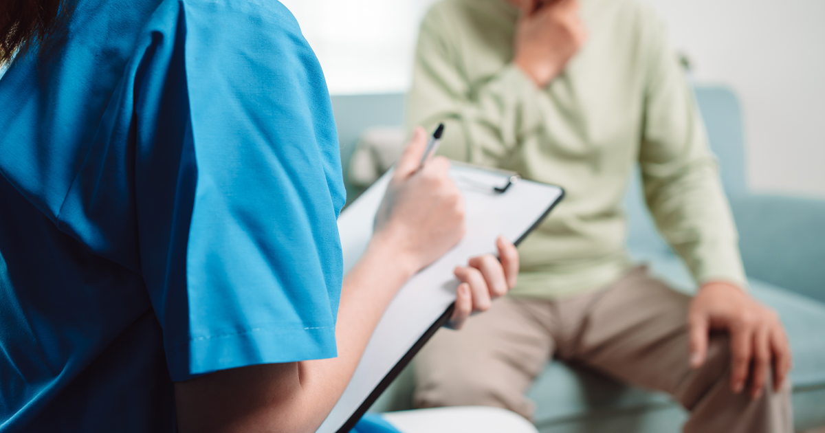 A nurse filling out form for their patients