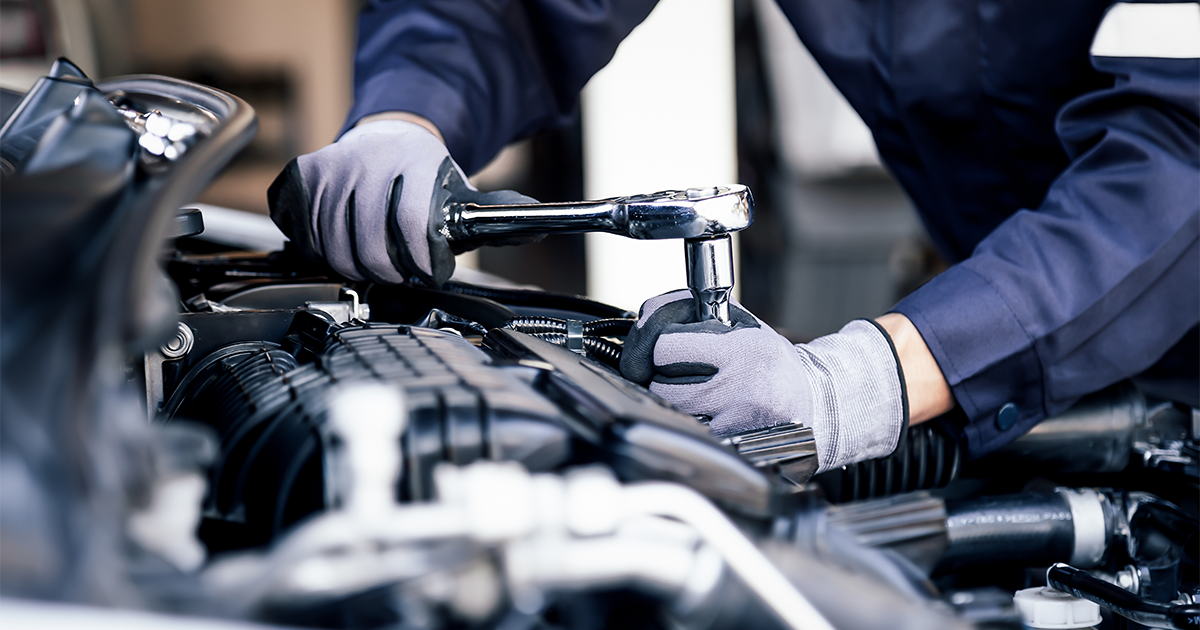 A mechanic fixing a vehicle