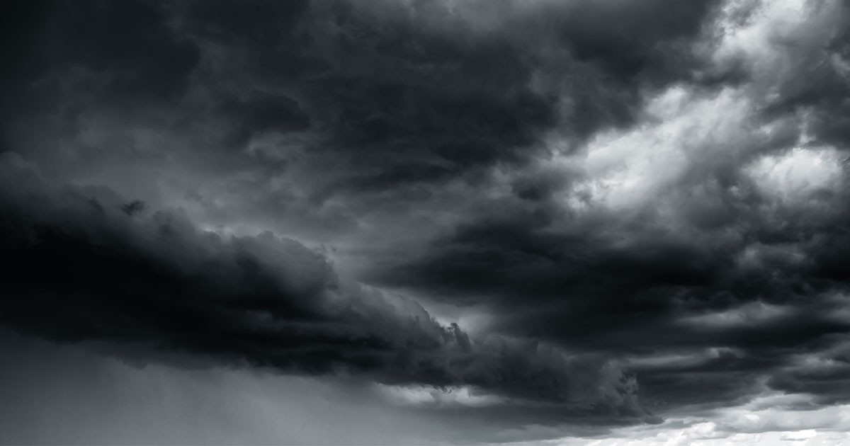 Dramatic storm clouds fill the sky with varying shades of gray.